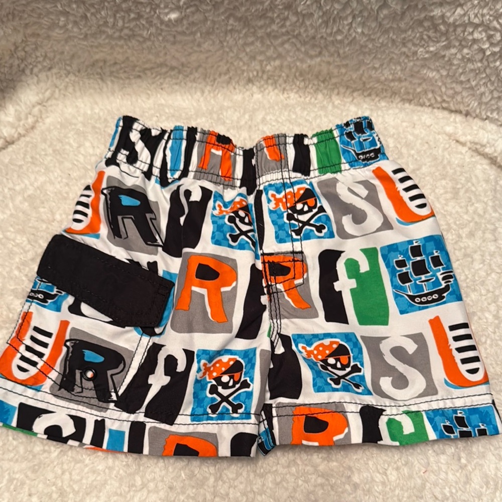 EST. 1989 Place Size 6-9 month pirate colorful swim trunks shorts